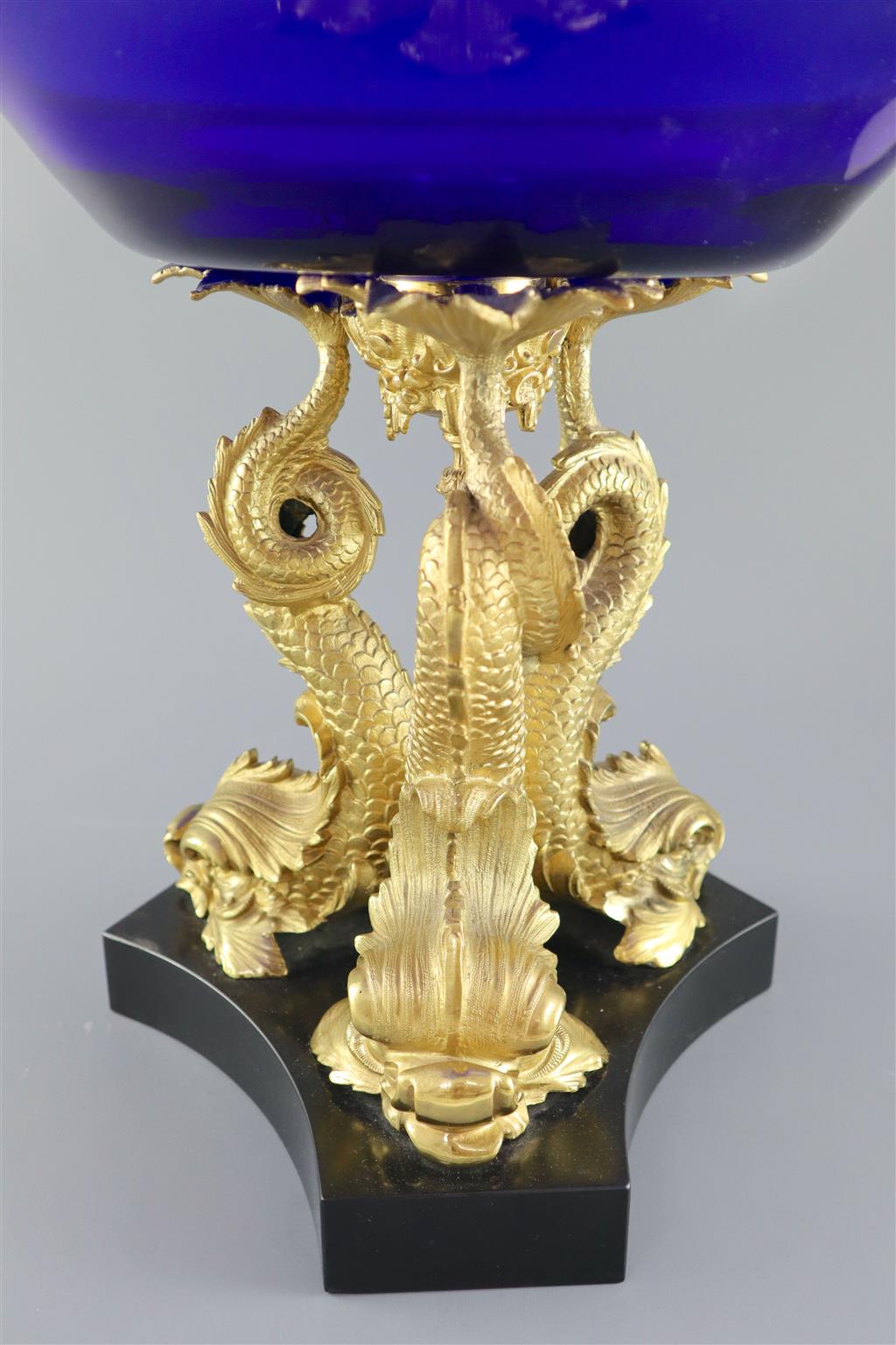 An impressive Regency blue glass and ormolu dolphin centrepiece fruit bowl, 39.5cm diameter